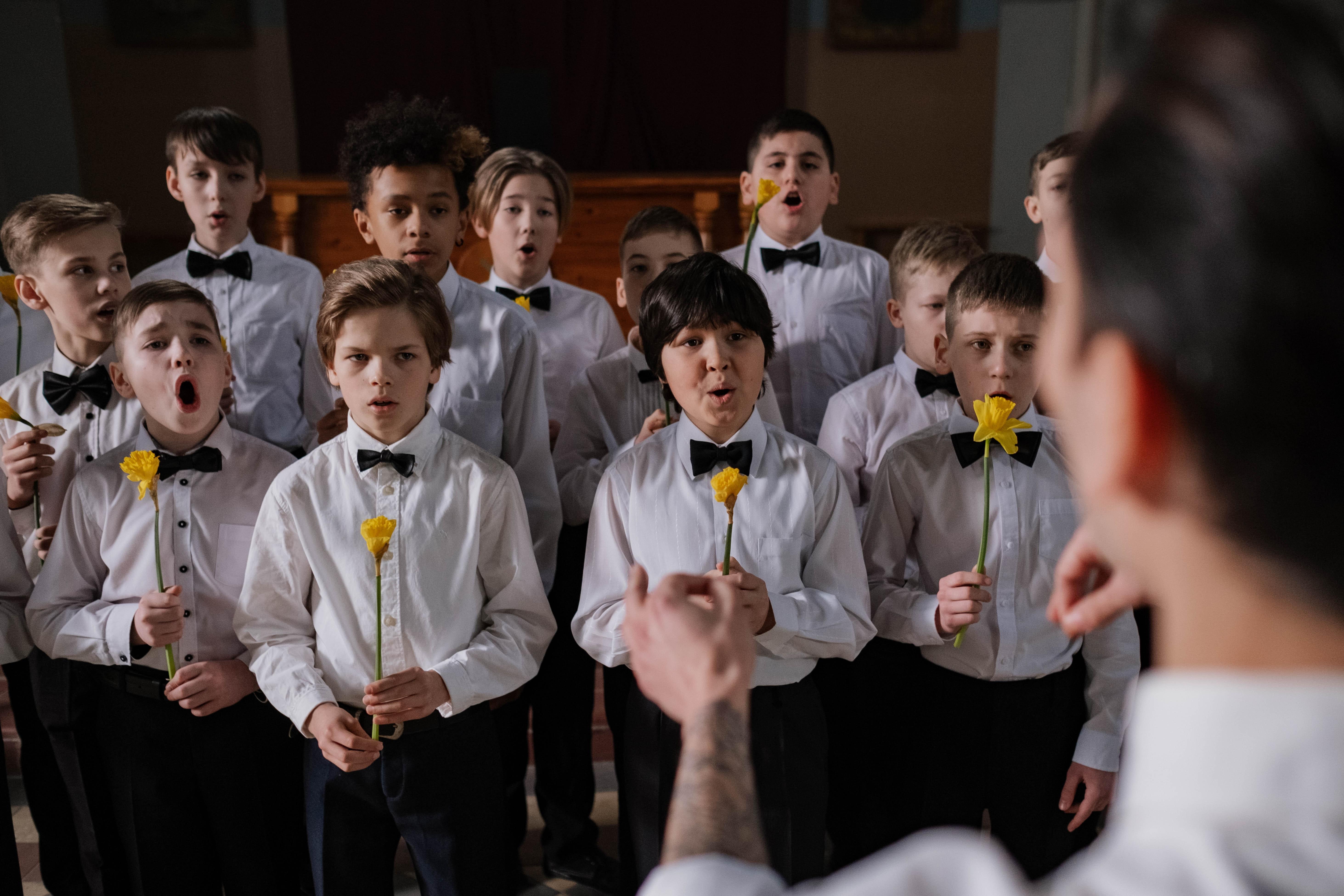 Why do boys wear arm bands for communion? 