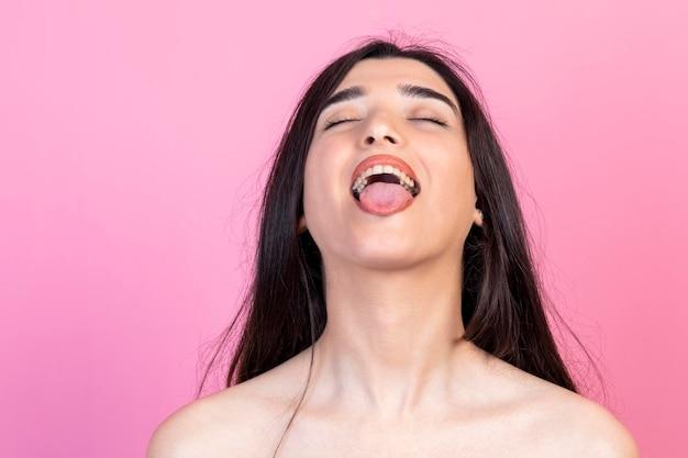 What does it mean when a girl sticks out her tongue? 