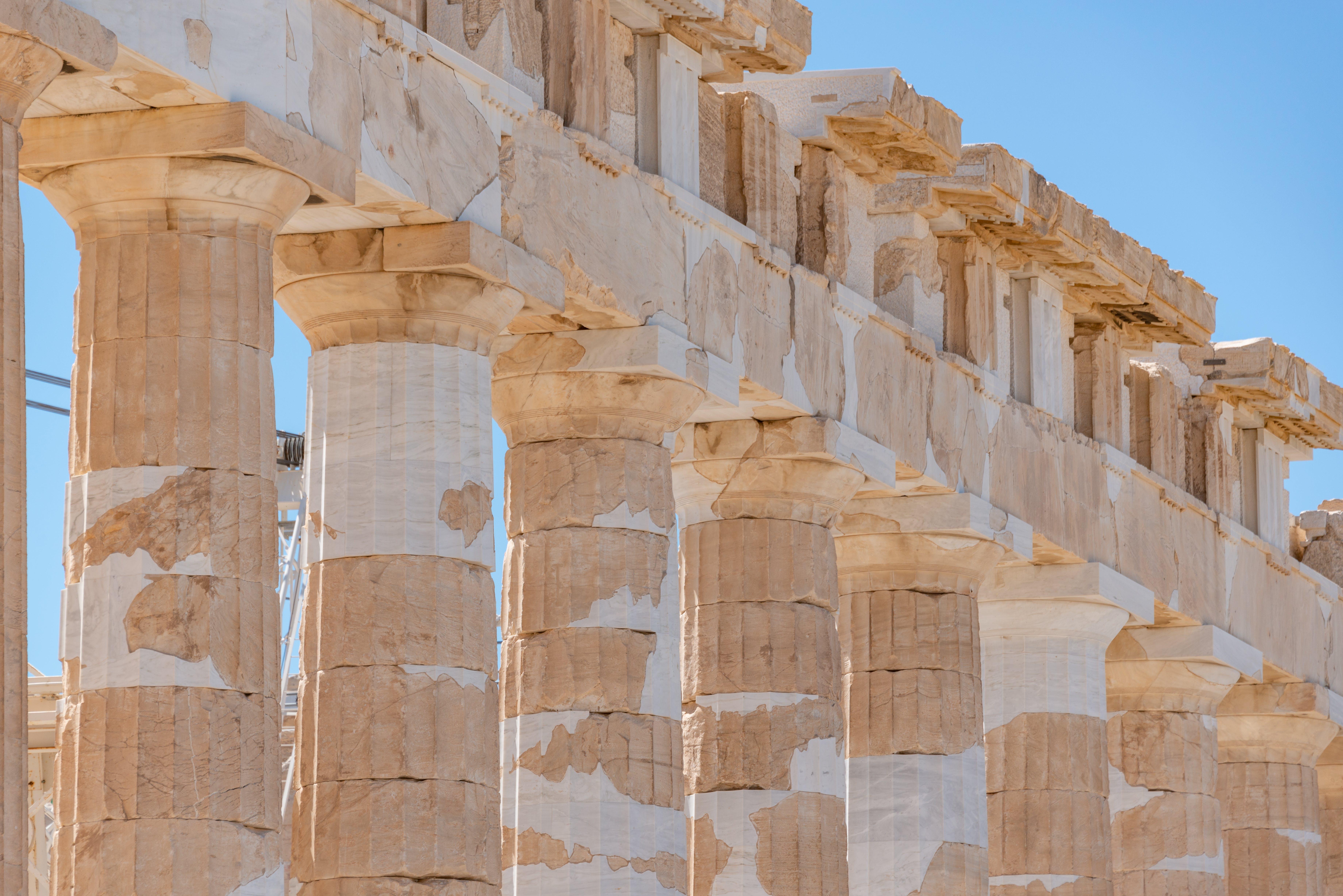 How did the Romans improve on Greek architecture? 
