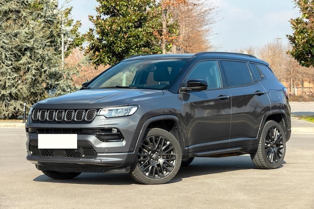 How do you close the hood on a Jeep Compass? 