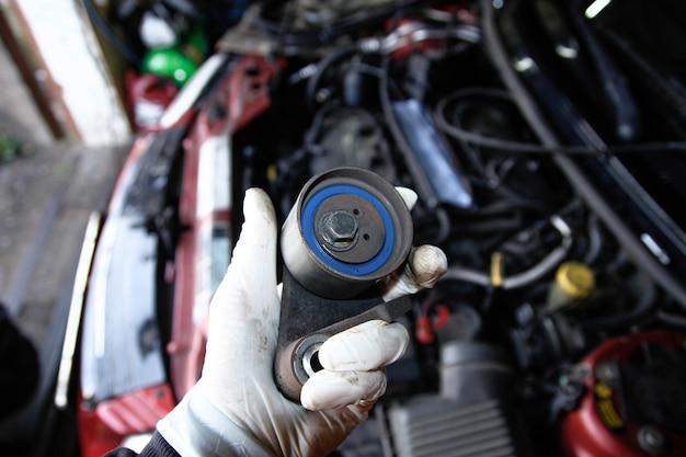 How do you remove a belt tensioner assembly? 