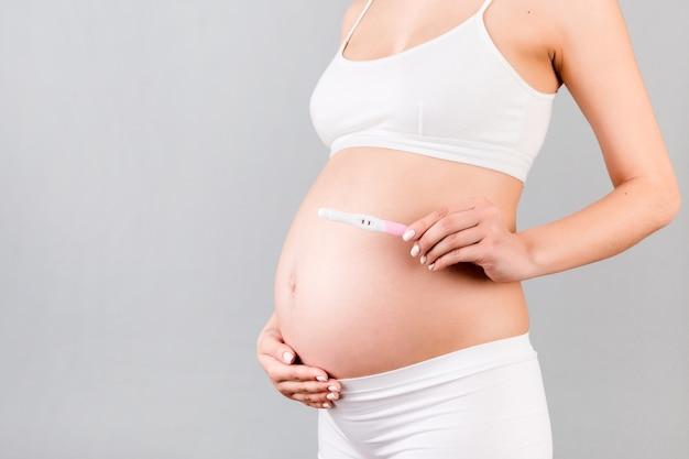 How do you place AED pads on a pregnant woman? 