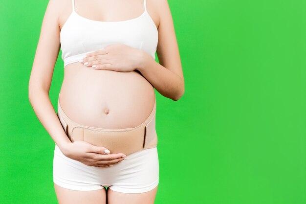 How do you place AED pads on a pregnant woman? 