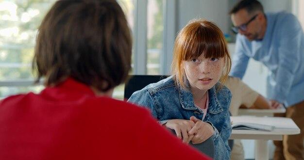 How do you start a conversation with a classmate girl? 