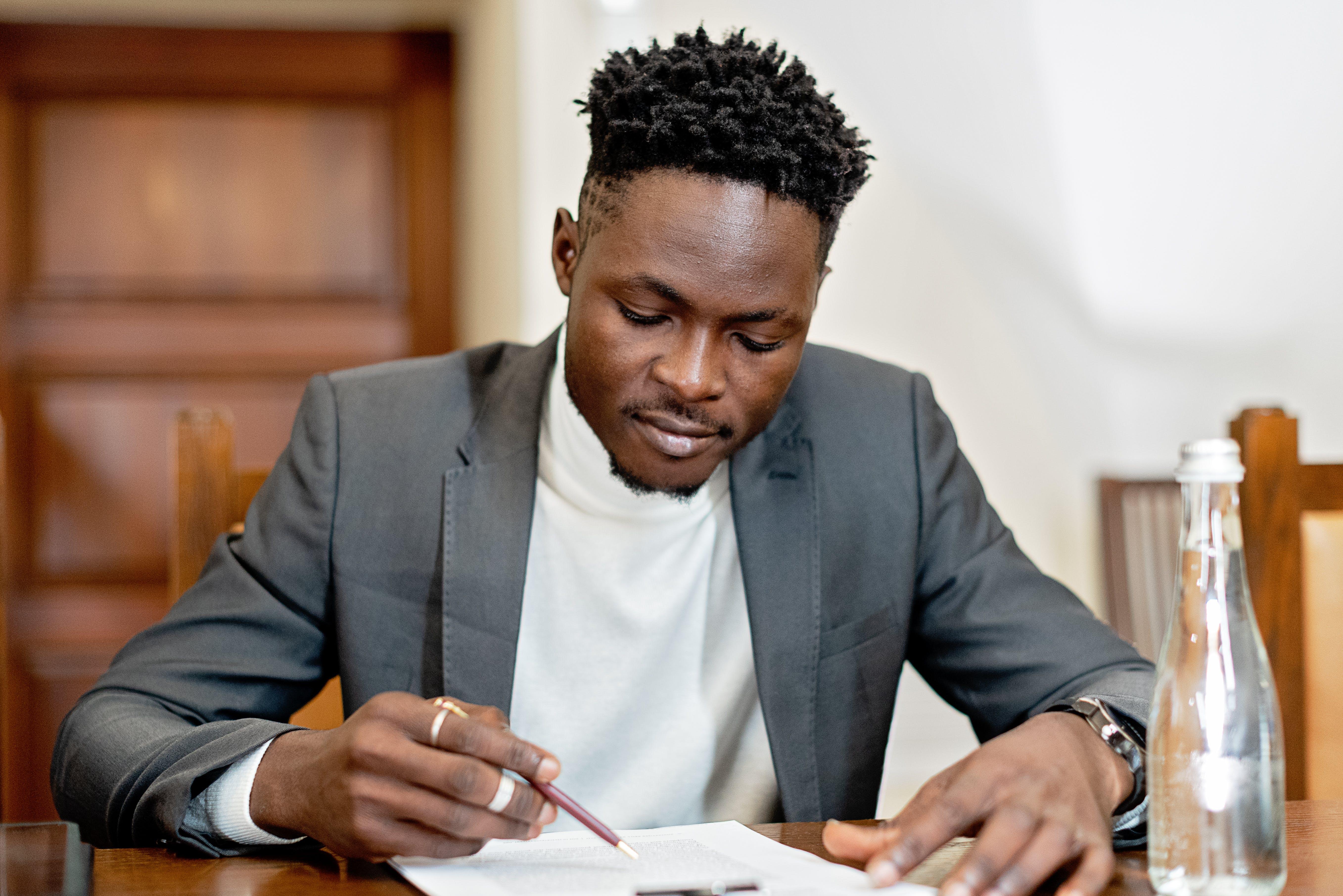 How do you write a letter on behalf of your boss? 