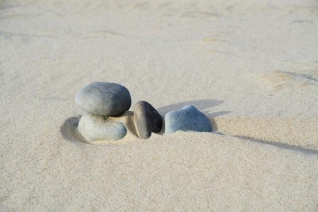 Is stone or sand heavier? 