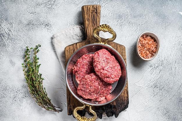What should I do if I ate raw hamburger? 