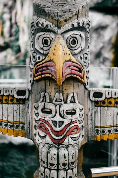 Which kind of artwork is a totem pole? 