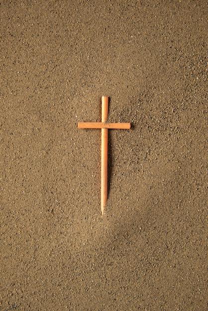 What does a cross with 3 dots above it mean? 