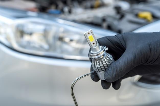 What holds the headlight bulb in place? 