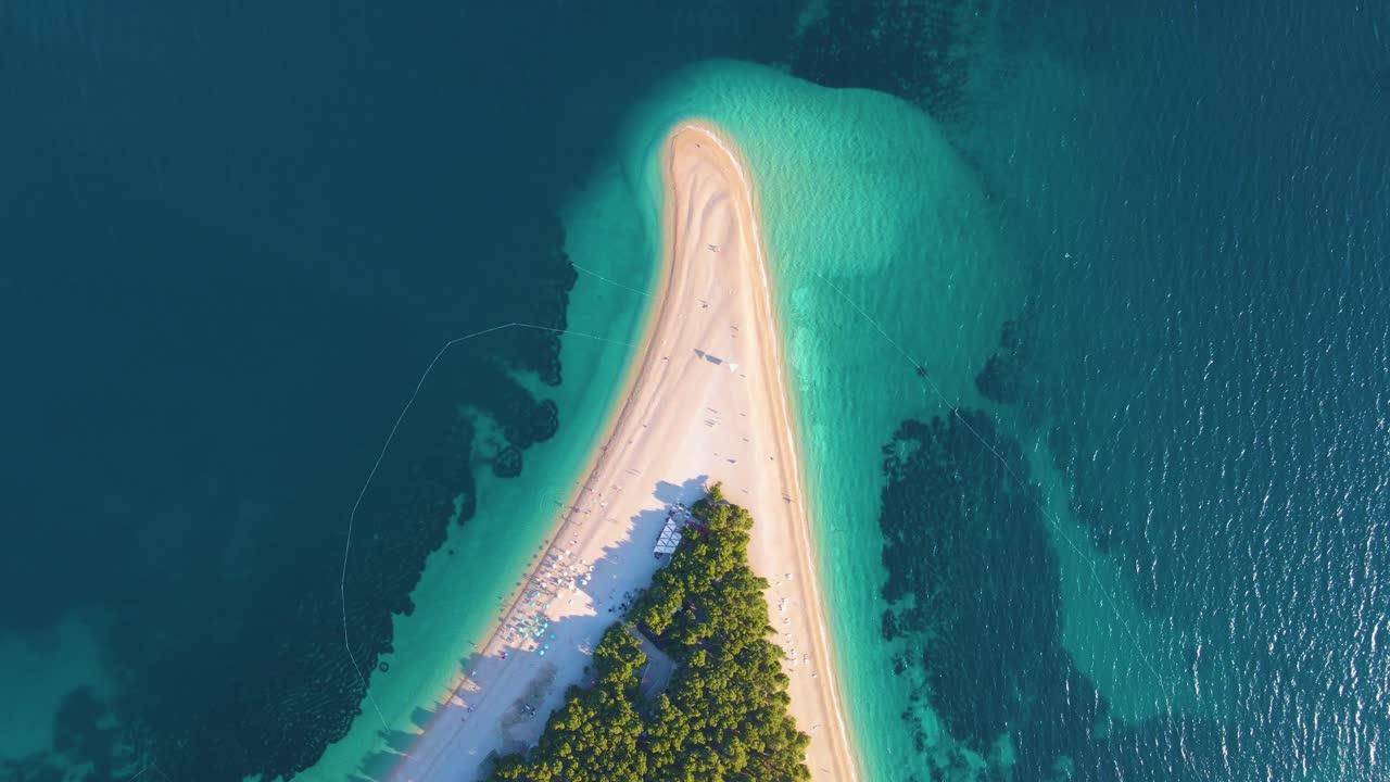 What is a piece of land surrounded by water called? 