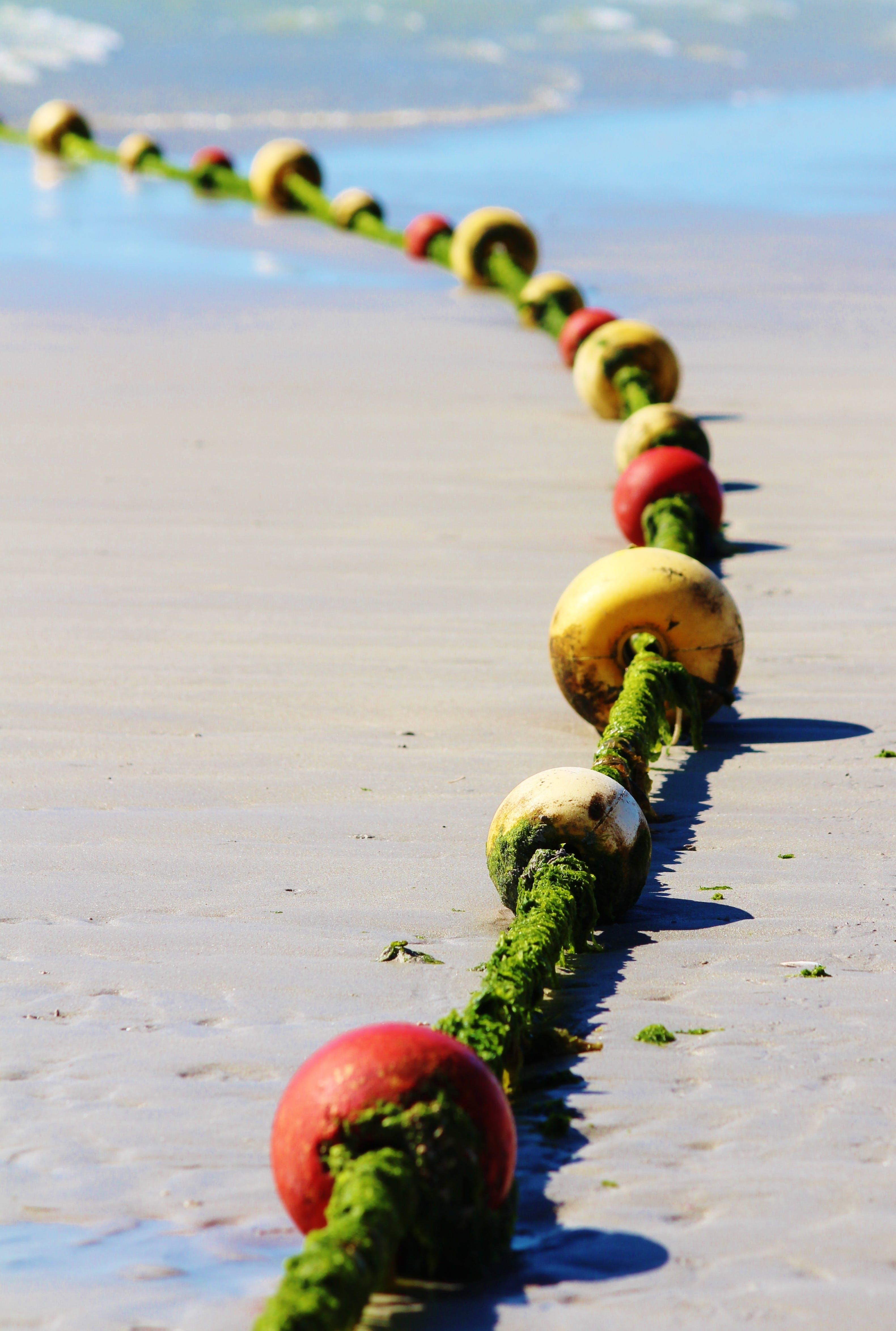 What is true about red buoys under the US Aids to Navigation System? 
