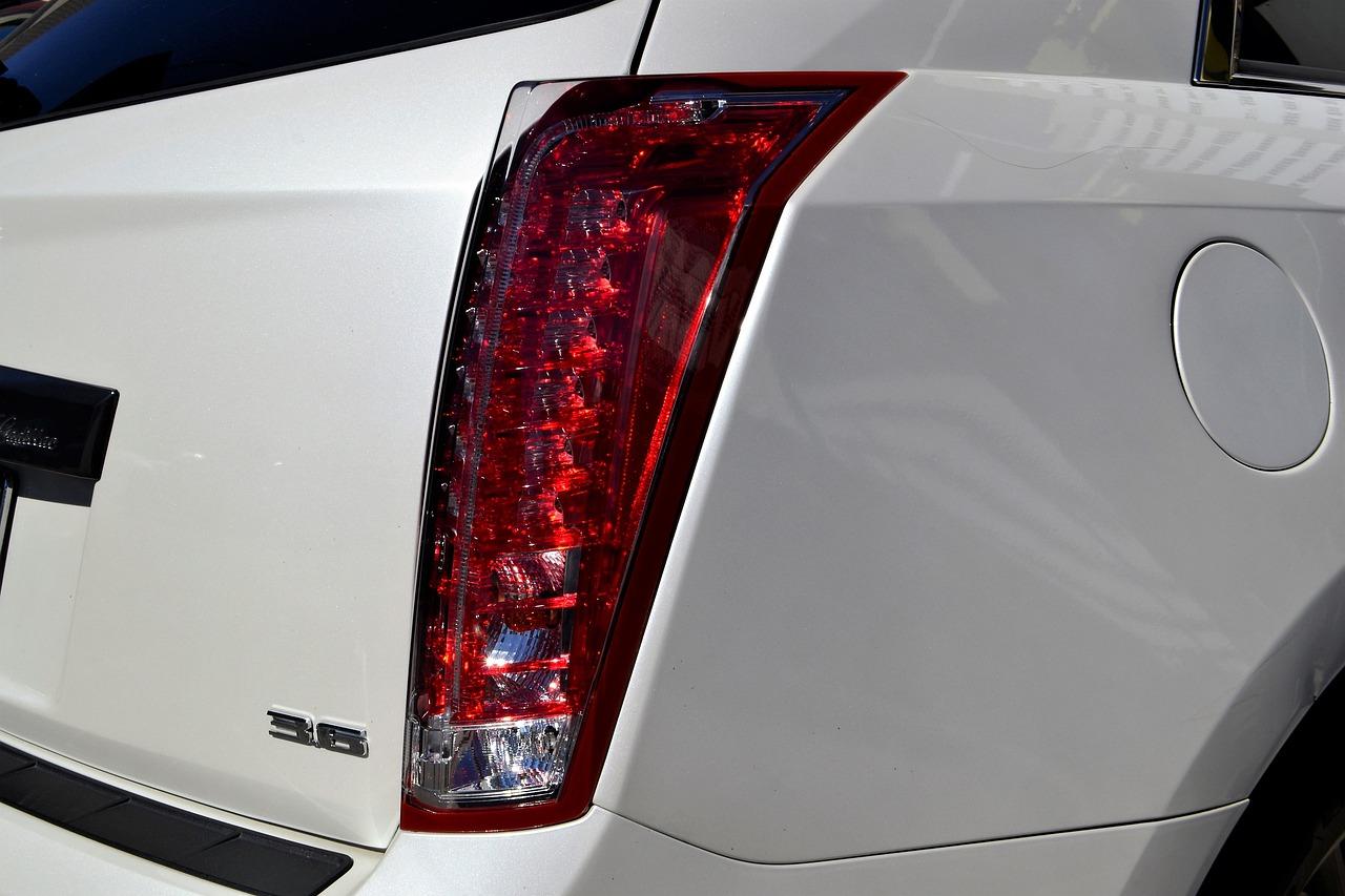 Where is the gas tank button on a Cadillac SRX? 
