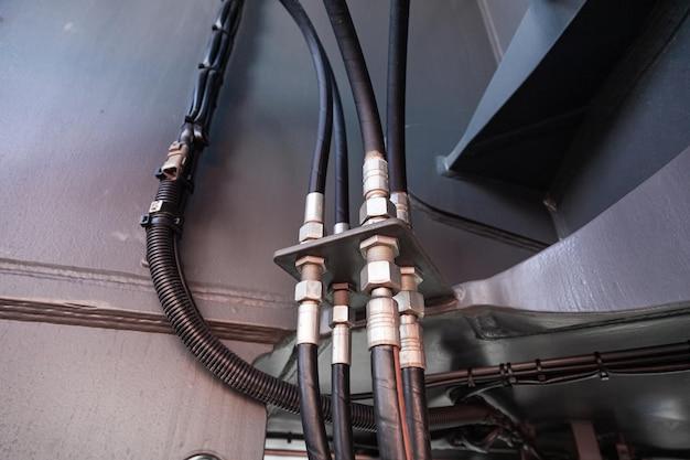 Where is the power steering high-pressure hose located? 