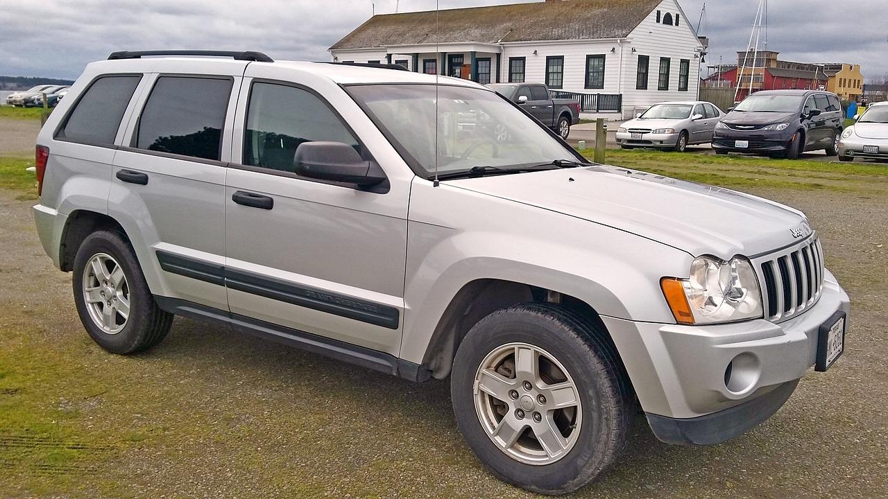 Where is the starter located on a 2008 Jeep Grand Cherokee Laredo? 