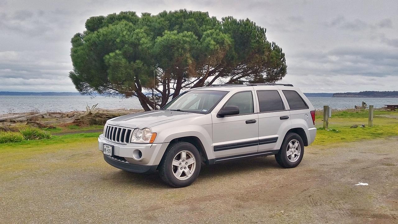 Where is the starter located on a 2008 Jeep Grand Cherokee Laredo? 