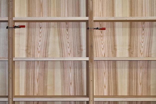 Why are manufactured boards veneered? 
