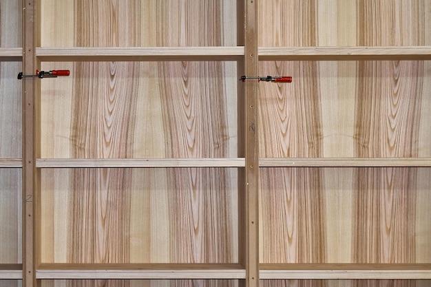 Why are manufactured boards veneered? 