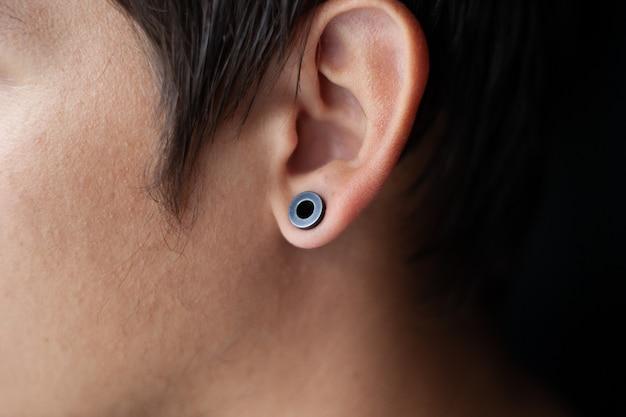 Why do guys wear earrings in left ear? 
